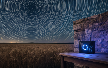 A long-exposure shot of satellite streaks in the night sky or a modern router glowing in a dark, rural setting.